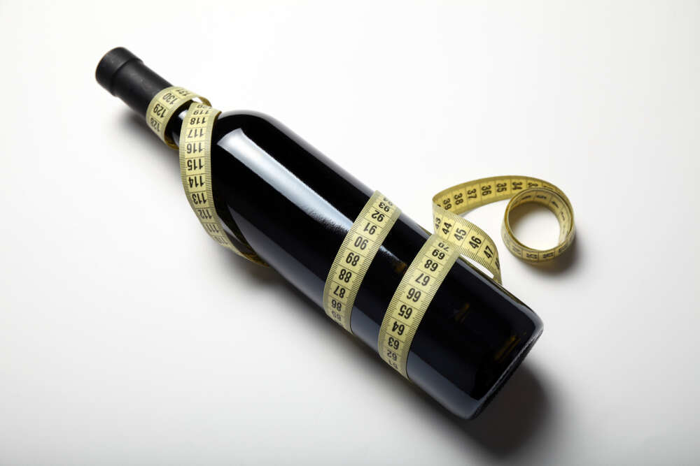 Wine and weight wine bottle with tape measure
