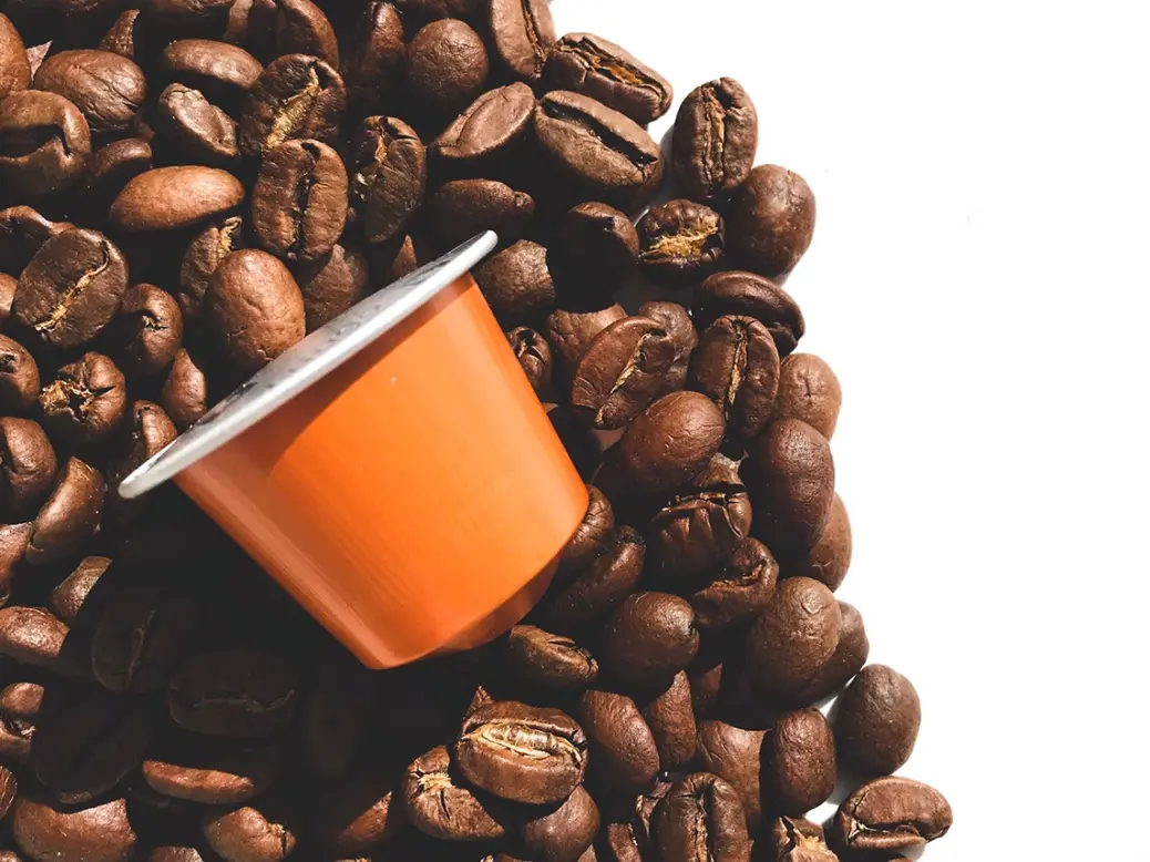 Nespresso pod with coffee beans