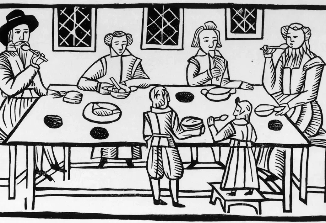 A 17th-century Puritan family having dinner