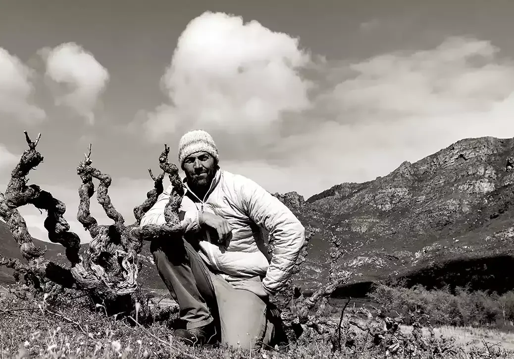 Eben Sadie in a vineyard with old vines.