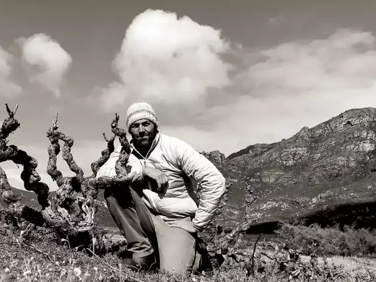 Eben Sadie in a vineyard with old vines.