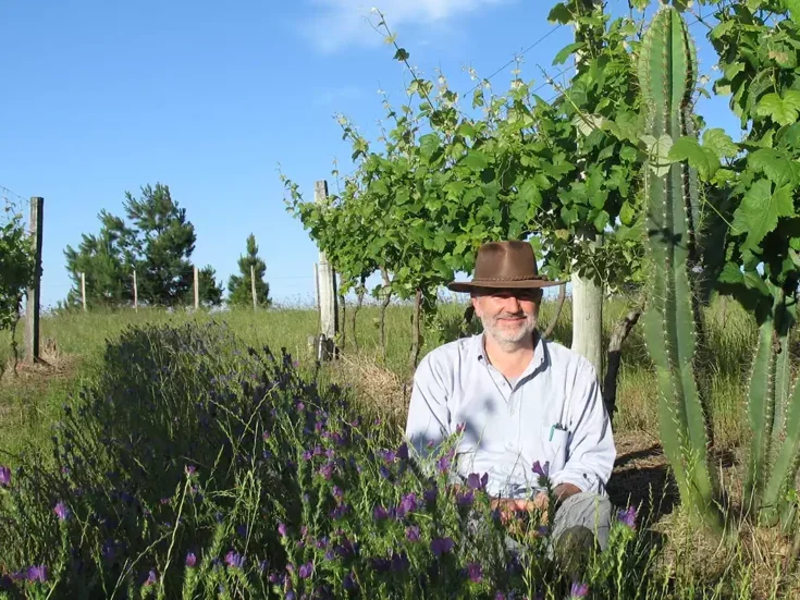 Francisco Carrau in a vineyard with cactus