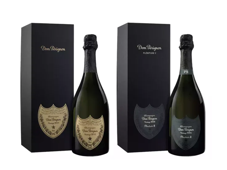 Two bottles of Dom Pérignon Champagne, each one new to its black gift box.