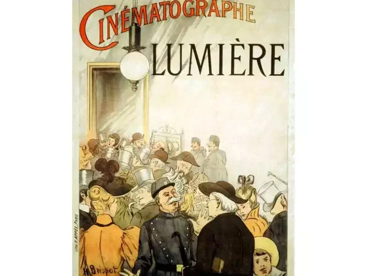 A poster from 1895 depicting a busy room full of people and the words Cinematoraphie Lumière