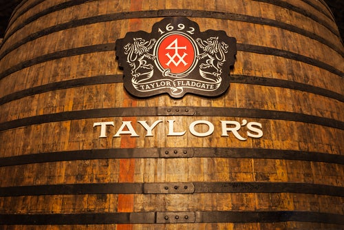 An enormous wooden vat with the Taylor's logo on the front in the Taylor's Port lodge in Vila Nova di Gaia.