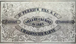 An old Joseph Perrier label with black letters on shiny silver patterned paper