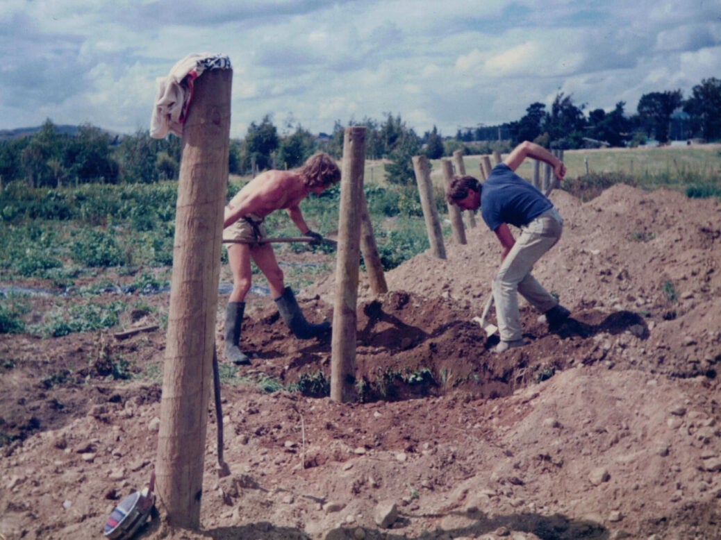 Digging post holes at Ata Rangi in the early years of the 1980s. A bleached out photo with sandy soils